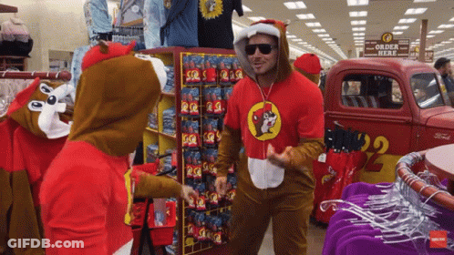 A Man In A Squirrel Costume Is Standing In Front Of A Truck That Says Order Here GIF