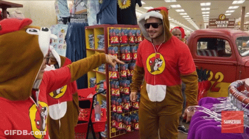A Man In A Squirrel Costume Points At Something GIF