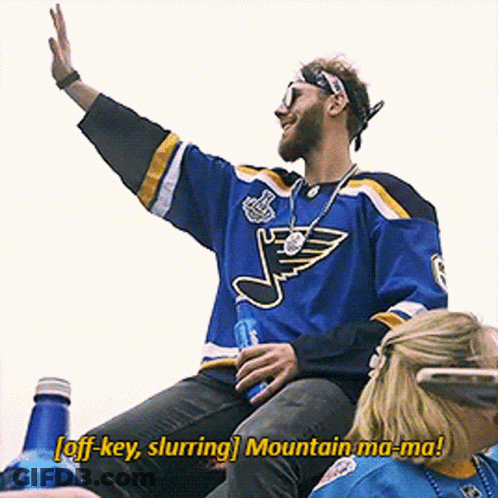 A Man In A St. Louis Blues Jersey Says Off Key Slurring Mountain Ma-Ma! GIF