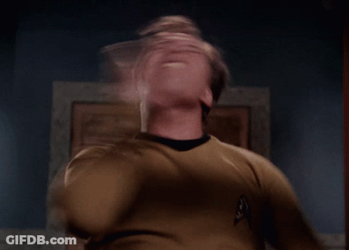 A Man In A Star Trek Uniform Is Making A Face GIF