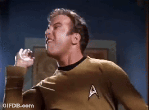 A Man In A Star Trek Uniform Is Making A Funny Face GIF