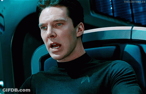 A Man In A Star Trek Uniform Is Sitting In A Chair With His Mouth Open And The Words The Lost Smiles Below Him GIF