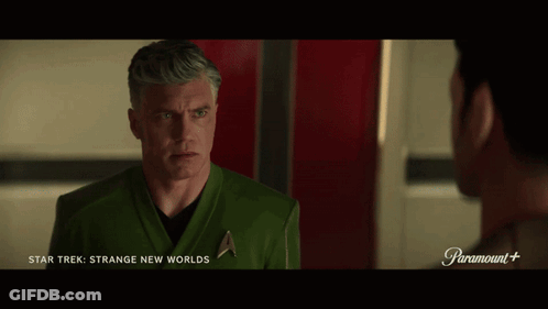 A Man In A Star Trek Uniform Talks To Another Man In A Paramount + Ad GIF