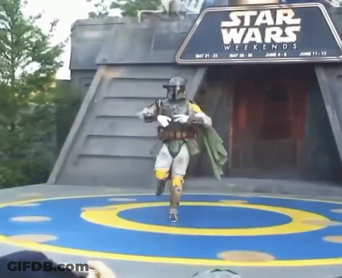 A Man In A Star Wars Costume Is Dancing On A Stage GIF