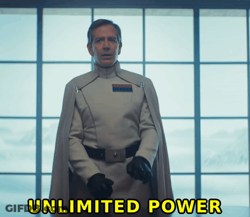 A Man In A Star Wars Uniform Stands In Front Of A Window With The Words Unlimited Power Written Below Him GIF