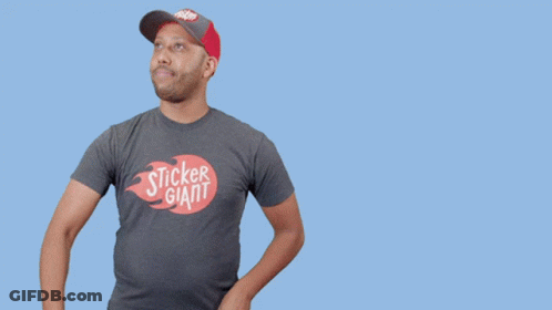 A Man In A Sticker Giant T-Shirt Holds A Hammer GIF