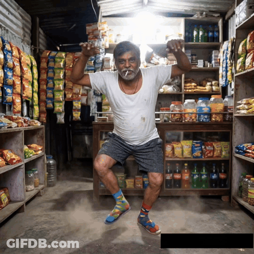 A Man In A Store With A Bag Of Chips That Says Lays On It GIF