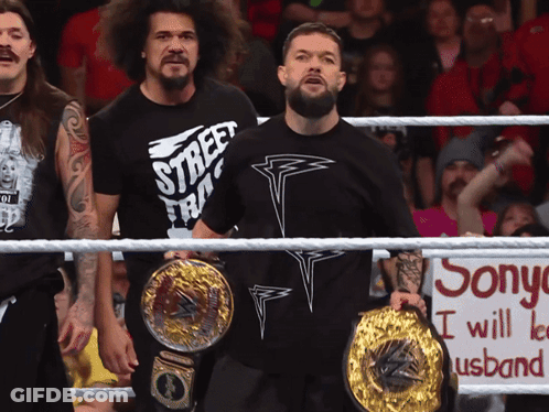 A Man In A Street Fighter Shirt Stands In A Ring GIF