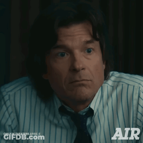 A Man In A Striped Shirt And Tie Is Advertising Air GIF