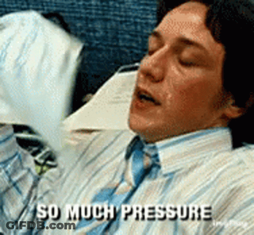 A Man In A Striped Shirt And Tie Is Laying Down And Says " So Much Pressure " GIF