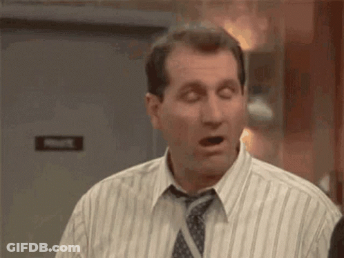 Man In Striped Shirt And Tie Making Funny Face GIF