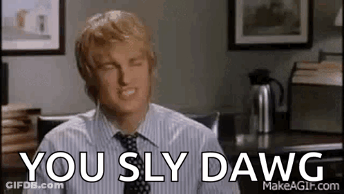 Man In Striped Shirt And Tie Sitting At Desk GIF