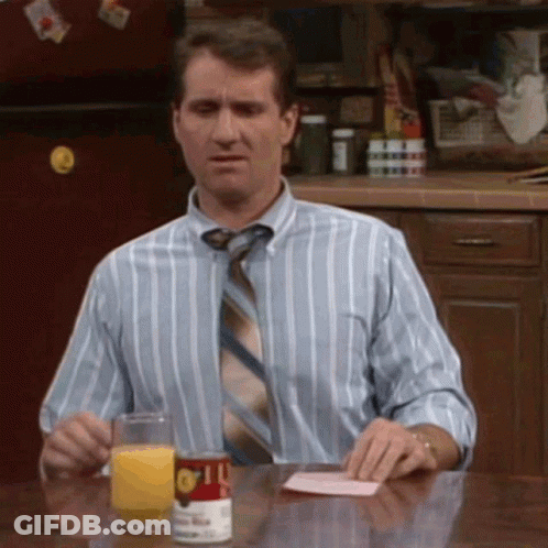 Man In Striped Shirt And Tie Sitting At Table With Orange Juice GIF