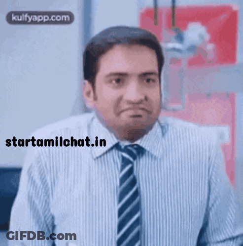 A Man In A Striped Shirt And Tie Making A Funny Face GIF