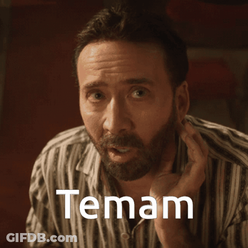 A Man In A Striped Shirt Has The Word Temam Written On His Face GIF