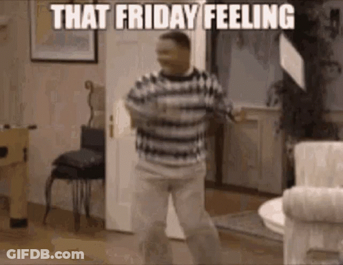 A Man In A Striped Shirt Is Dancing In A Living Room . GIF