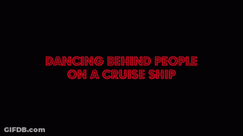 A Man In A Striped Shirt Is Dancing In A Restaurant With Other People GIF