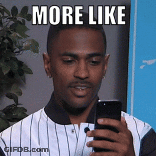 A Man In A Striped Shirt Is Holding A Cell Phone With The Words More Like Above Him GIF