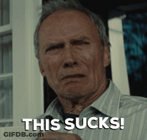A Man In A Striped Shirt Is Holding A Cup And Says " This Sucks " GIF