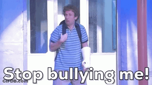 A Man In A Striped Shirt Is Holding A Megaphone And Saying Stop Bullying Me GIF
