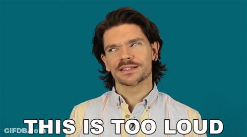 A Man In A Striped Shirt Is Making A Funny Face With The Words This Is Too Loud Below Him GIF