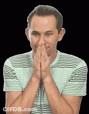 A Man In A Striped Shirt Is Praying With His Hands Together GIF