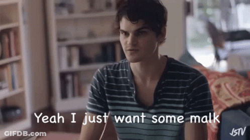 A Man In A Striped Shirt Is Sitting On A Couch And Saying Yeah I Just Want Some Malk GIF