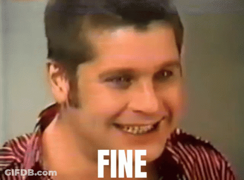 A Man In A Striped Shirt Is Smiling With The Word Fine On His Face GIF