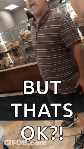 A Man In A Striped Shirt Is Standing In A Bakery And Says But That 'S Ok . GIF