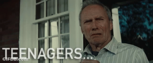 A Man In A Striped Shirt Is Standing In Front Of A Window With The Word Teenagers Written On The Bottom GIF