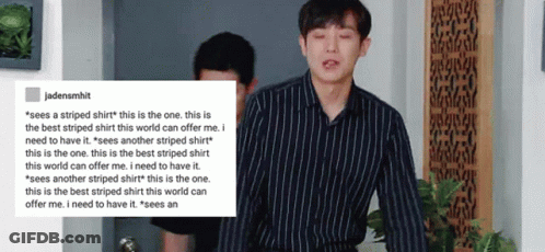 A Man In A Striped Shirt Is Standing Next To Another Man In A Black Shirt .. GIF