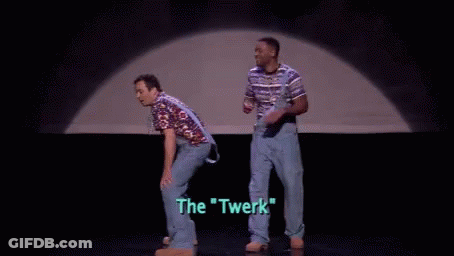 A Man In A Striped Shirt Is Standing On A Stage With The Words `` The Twerk '' Written On The Screen . GIF