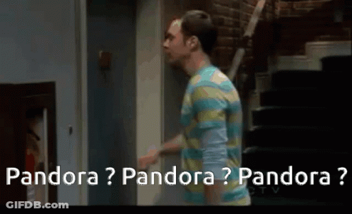 A Man In A Striped Shirt Is Walking Down Stairs And Talking To Another Man . GIF