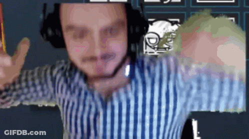 A Man In A Striped Shirt Is Wearing Headphones And Giving A Peace Sign GIF