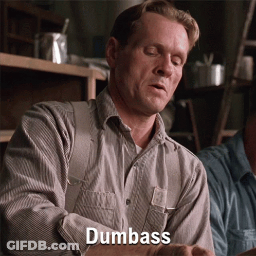 A Man In A Striped Shirt Says Dumbass In Front Of Him GIF