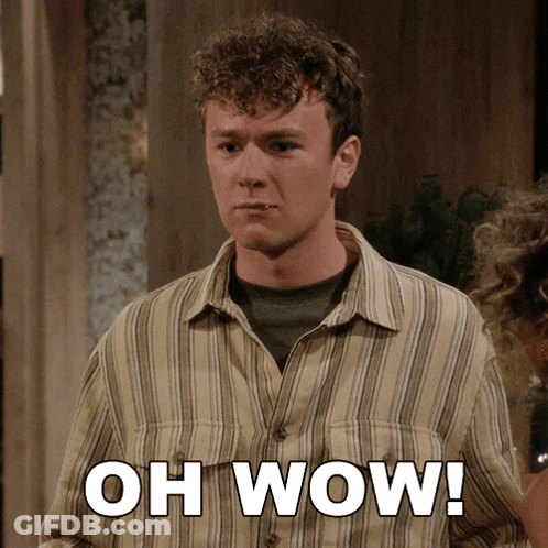 A Man In A Striped Shirt Says " Oh Wow " In White Letters GIF