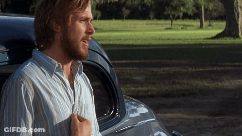 A Man In A Striped Shirt Stands Next To A Car GIF