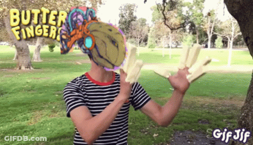 A Man In A Striped Shirt With Butter Fingers On His Shirt GIF