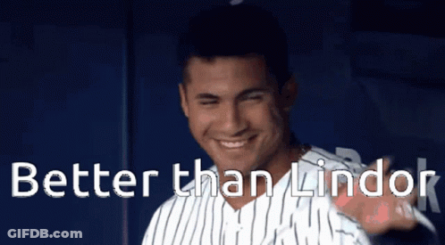 A Man In A Striped Shirt With The Words Better Than Lindor Behind Him GIF