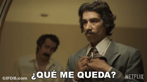 A Man In A Suit Adjusts His Tie And Says " Que Me Queda " GIF