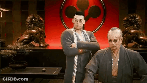 A Man In A Suit And A Man In A Kimono Are Standing Next To Each Other . GIF