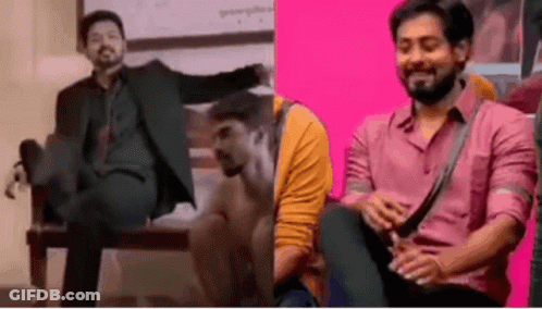 A Man In A Suit And A Man In A Pink Shirt Are Sitting On A Chair . GIF