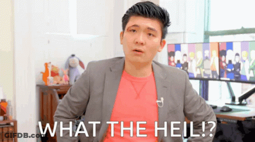 A Man In A Suit And A Pink Shirt Says What The Hell GIF