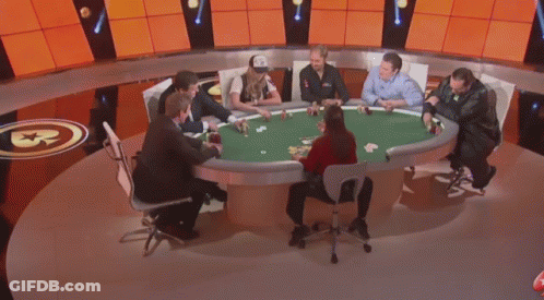 A Man In A Suit And A Woman In A Police Uniform Are Playing Poker . GIF