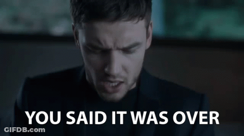 A Man In A Suit And Black Shirt Is Saying You Said It Was Over . GIF