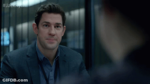 A Man In A Suit And Blue Shirt Talks To Another Man With The Hashtag #Jackryan GIF