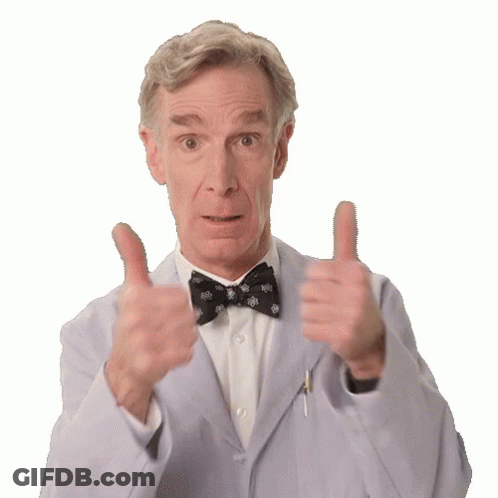 A Man In A Suit And Bow Tie Is Giving A Thumbs Up GIF