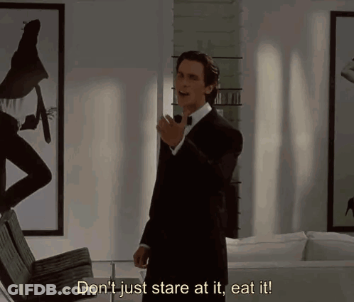 A Man In A Suit And Bow Tie Says " Don 'T Just Stare At It Eat It " GIF