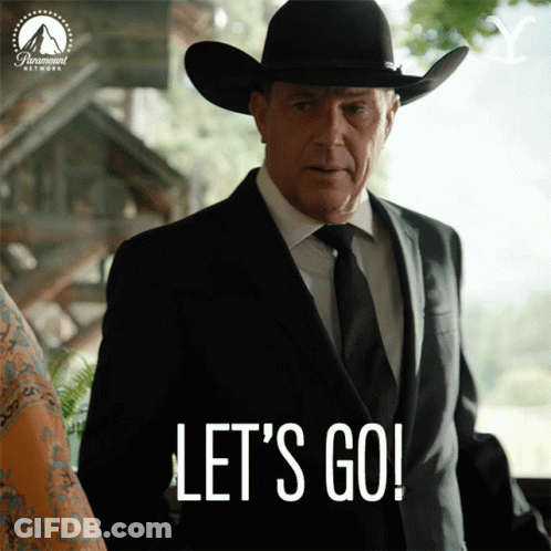 A Man In A Suit And Cowboy Hat Is Saying Let 'S Go GIF