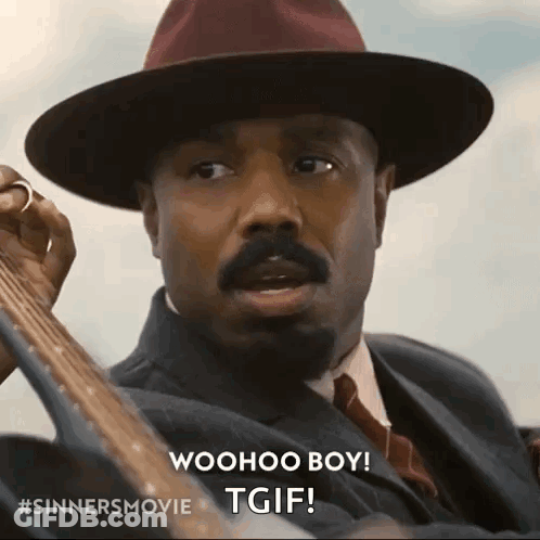 A Man In A Suit And Hat Is Holding A Guitar And Saying Woohoo Boy GIF